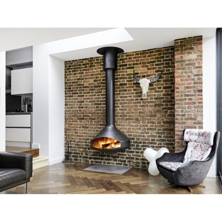 A industrial style fireplace in a living room with stylish brick wall with metal and concrete design.