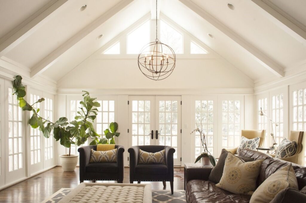 Bright living room with vaulted ceilings and large window designs